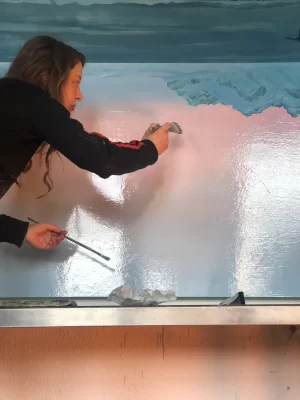 Georgia Rose Murray working on a painting